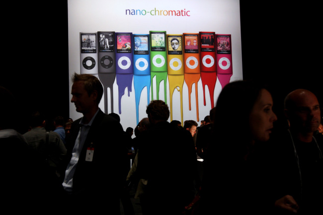 A poster displays the various color options for Apple iPod Nano media players in San Francisco, California.    Bloomberg