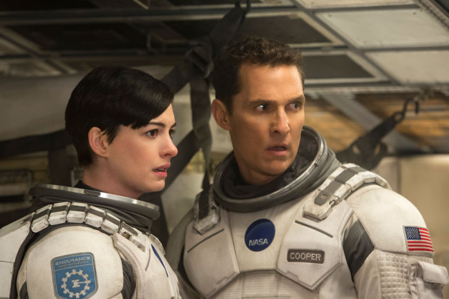 Amelia Brand (Anne Hathaway, left) and Cooper (Matthew McConaughey) in a scene from “Interstellar.”    Warner Bros.