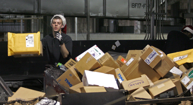 A worker sorts packages at the UPS facility in Hodgkins, Illinois.    Bloomberg