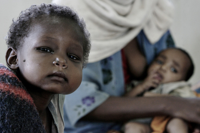 A boy sits on a mattress at a feeding center in Damota Pulassa, Wolayta, Ethiopia.     Bloomberg
