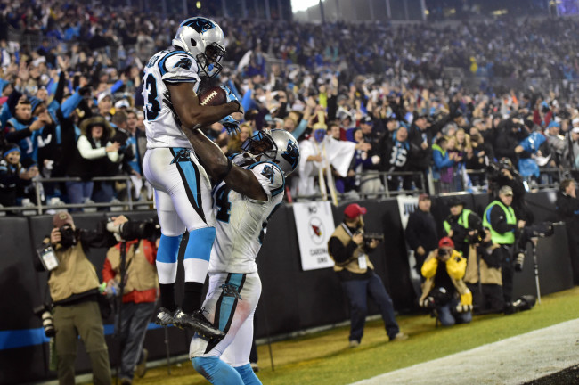 Carolina Panthers running back Fozzy Whittaker (left) celebrates with tight end Ed Dickson after scoring a touchdown in the third quarter on Saturday.   USA Today-Yonhap