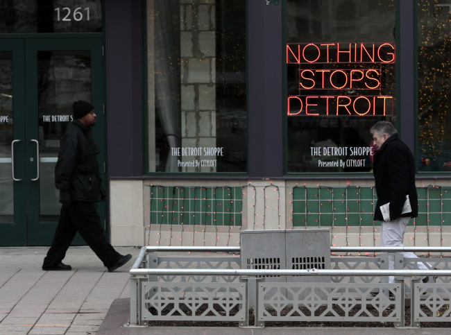A “Nothing Stops Detroit” sign hangs in the window of the Detroit Shoppe on Woodward Avenue in Detroit, Michigan.   Bloomberg