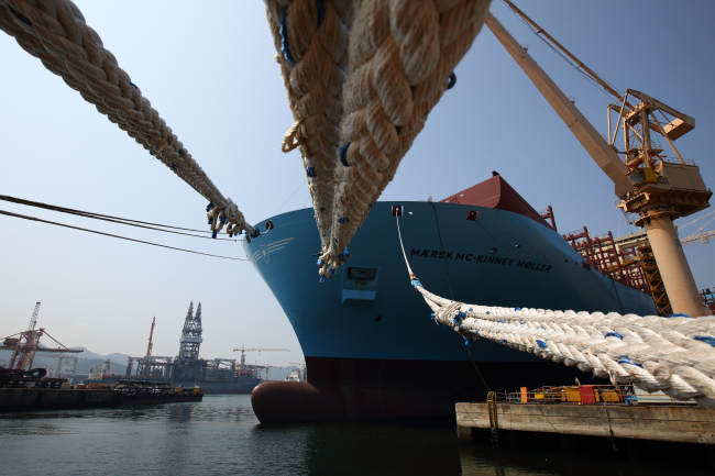 Maersk’s Triple E-class container vessel sits moored under construction at the DSME shipyard in Geoje, South Gyeongsang Province.   Bloomberg