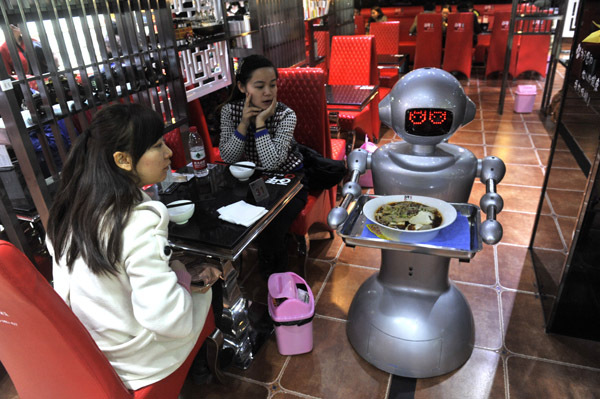 A robot waits on a table at a restaurant in Chengdu, Sichuan Province.