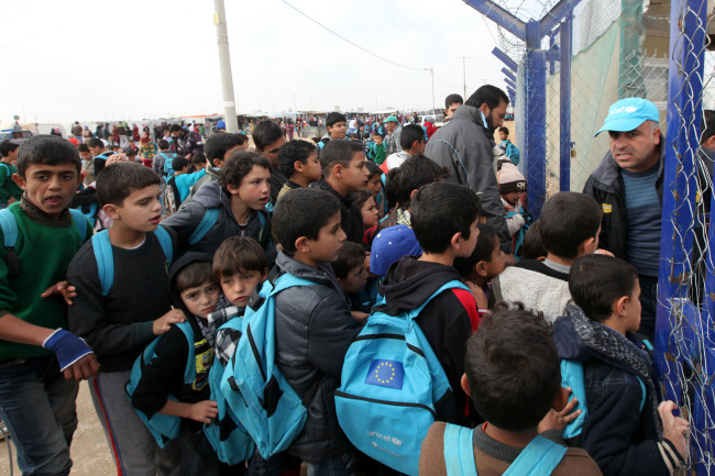 Syrian refugee children are seen at the Syrian Zattari refugee camp near Mafraq city in Jordan on Dec. 1.    Xinhua-Yonhap