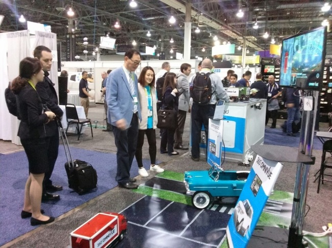Baek Won-in (third from left), the chief executive of ImageNEXT, inspects his company’s booth at 2015 International CES in Las Vegas on Tuesday.    Kim Young-won/The Korea Herald