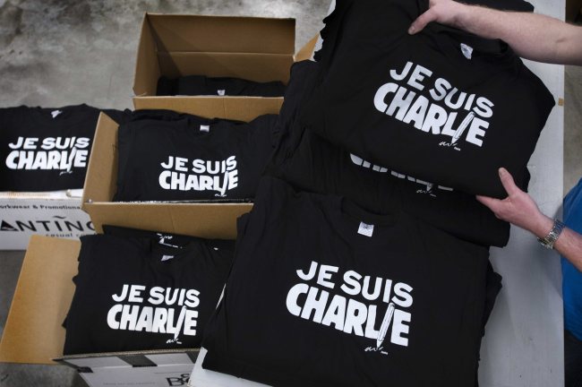 T-shirts are being printed with the slogan “Je Suis Charlie (I am Charlie)” at the printing house Festa in Langenboom, the Netherlands.   EPA-Yonhap