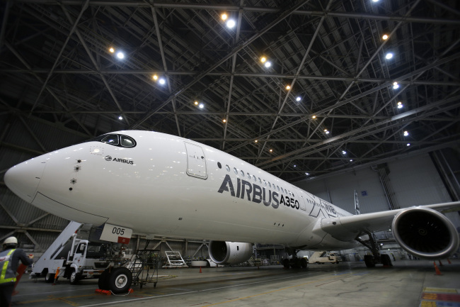 An Airbus A350 XWB aircraft inside Japan Airlines’ hangar at Haneda Airport in Tokyo.   Bloomberg