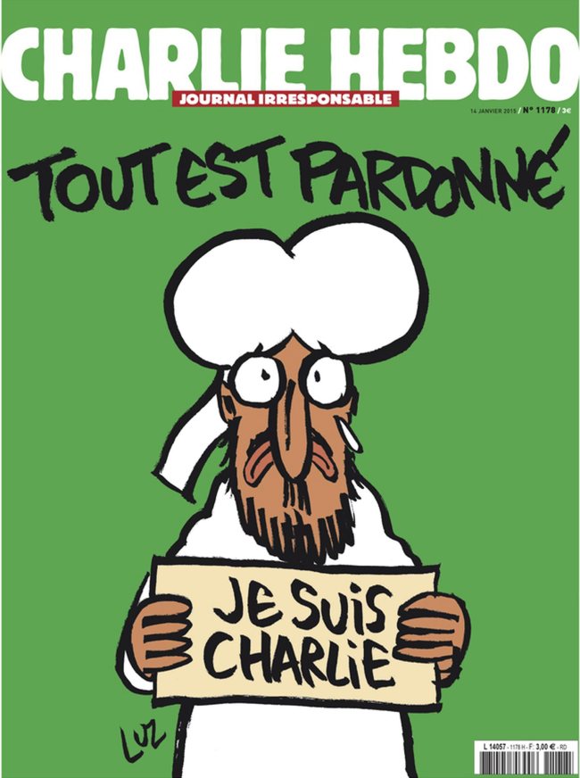 An image released by French newspaper Charlie Hebdo in Paris shows the front page with a cartoon of the Prophet Mohammed holding up a “Je suis Charlie (I am Charlie)” sign under the words “Tout est Pardonne (All is Forgiven).” EPA-Yonhap