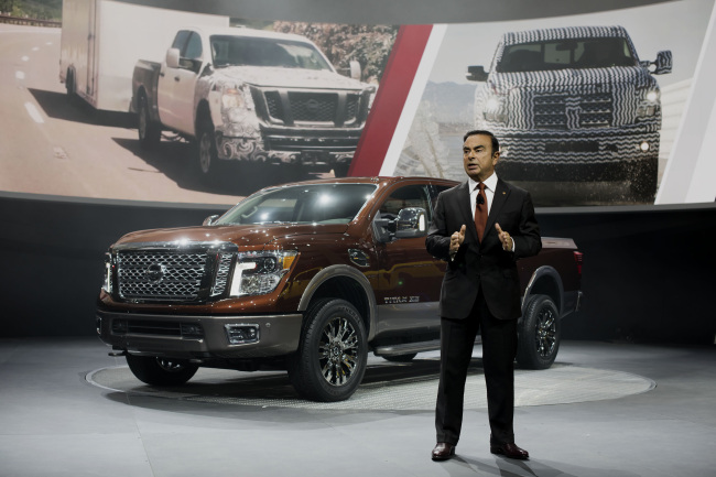 Carlos Ghosn, chief executive officer of Nissan Motor, speaks during the unveiling of the 2016 Nissan Titan XD truck at the 2015 North American International Auto Show in Detroit on Monday. Bloomberg