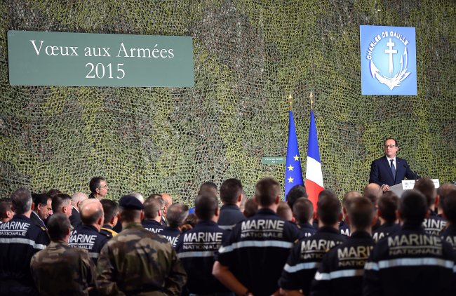 French President Francois Hollande delivers a speech during his visit on the French nuclear aircraft carrier Charles de Gaulle, to present his New Year wishes to the French military troops, off the coast of Toulon, France, Wednesday.   EPA-Yonhap