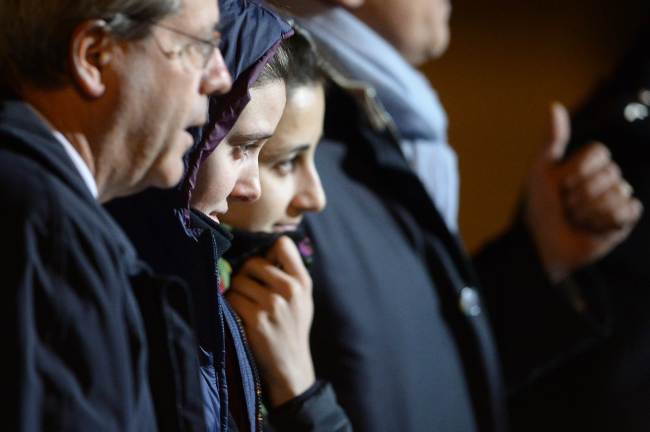 Greta Ramelli (center) and Vanessa Marzullo (right) are welcomed by Italy’s Minister of Foreign Affairs.   AFP-Yonhap