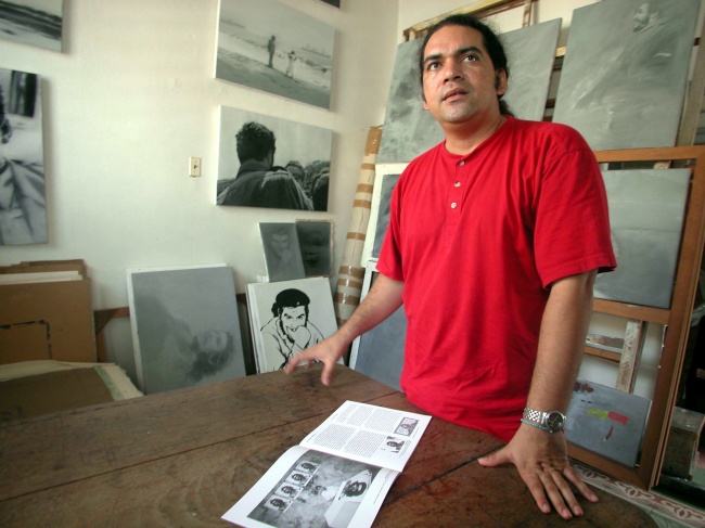 Cuban artist Jose Angel Toirac poses in his studio in Havana, Cuba. He has done a series of irreverent paintings of Fidel Castro that have not been exhibited.    Tribune Content Agency
Cuban artist Jose Angel Toirac poses in his studio in Havana, Cuba. He has done a series of irreverent paintings of Fidel Castro that have not been exhibited.    Tribune Content Agency