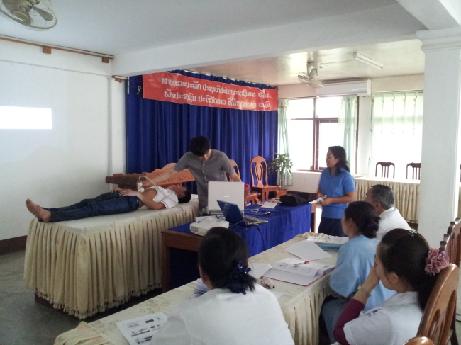 Members of KOHEA demonstrates telemedicine technology in Laos.   KOHEA
