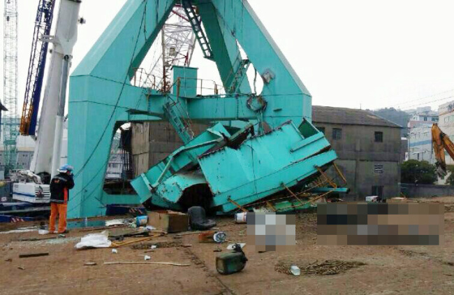 An emergency services official looks around the accident site in Busan on Wednesday. (Yonhap)