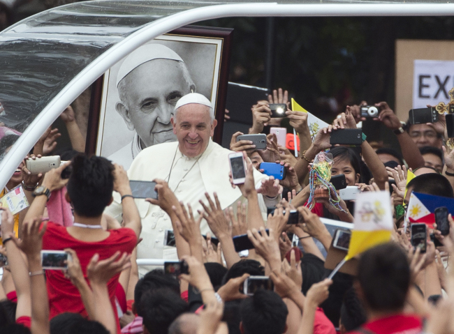 Pope Francis arrives to meet youths in Santo Tomas University in Manila, Philippines, Jan. 18.   AP