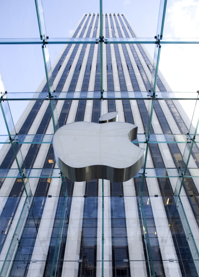 The Apple Computer logo sits on the outside of its retail store on 5th Avenue in New York. Bloomberg