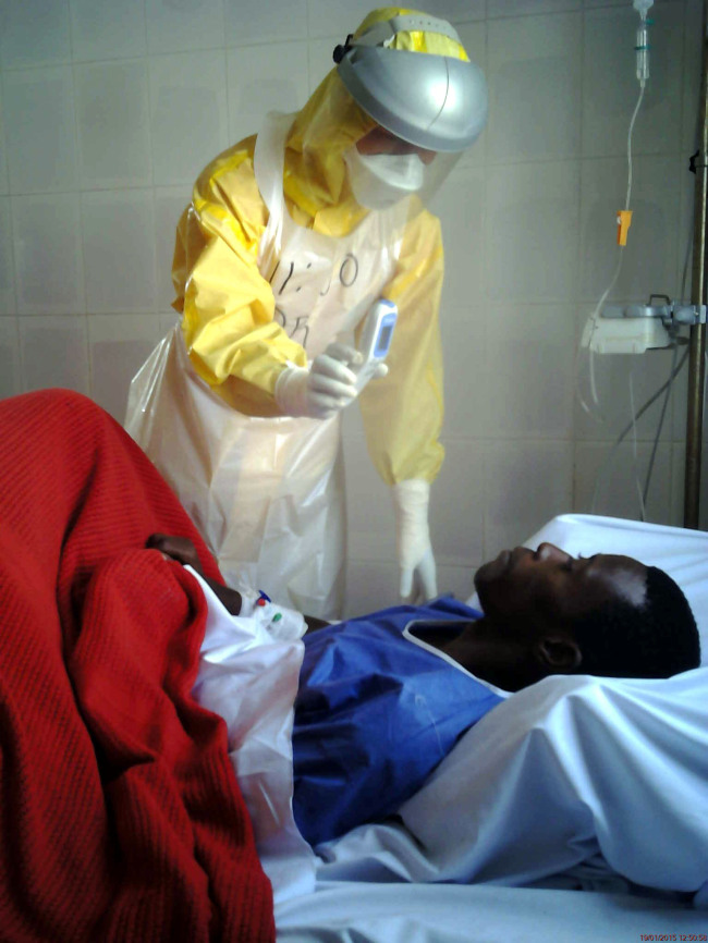 Capt. Lee Tae-heon, a Navy surgeon, attends a patient at the Ebola treatment center in Goderich in the suburbs of Freetown, Sierra Leone.   MOFA