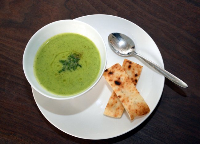 Panisse’s zucchini soup, made with zucchini and cream and topped with fresh basil, served with the establishment’s housemade flatbread