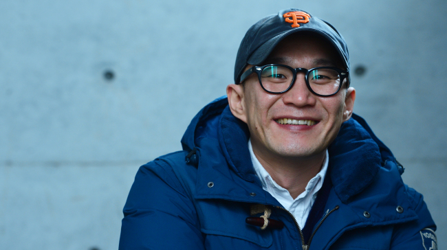 Director Lee Kwang-kuk poses before an interview with The Korea Herald at a cafe in Seoul on Wednesday.    Yoon Byung-chan/The Korea Herald
