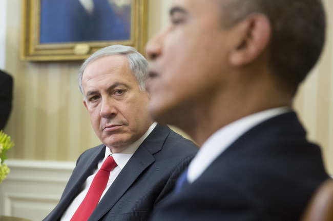 Benjamin Netanyahu, Israel’s prime minister (left), looks on as U.S. President Barack Obama speaks in the Oval Office of the White House in Washington, in March 2014.   Bloomberg