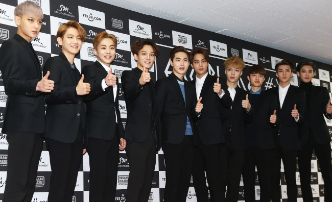 <YONHAP PHOTO-1275> 두 번째 단독 콘서트 개최한 엑소 (서울=연합뉴스) 홍기원 기자 = 두 번째 단독 콘서트 '엑소 플래닛 #2 - 더 엑솔루션 -'(EXO PLANET #2 - The EXO'luXion -)을 개최하는 그룹 엑소가 8일 오후 서울 송파구 방이동 올림픽공원 체조경기장에서 열린 기자회견에서 포즈를 취하고 있다. 2015.3.8 xanadu@yna.co.kr/2015-03-08 15:44:46/ <저작권자 ⓒ 1980-2015 ㈜연합뉴스. 무단 전재 재배포 금지.>
The members of EXO pose at a press conference before their live concert in the Gymnastics Stadium at Seoul Olympic Park on Sunday.    Yonhap