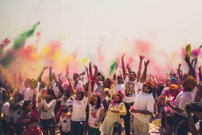 Revelers celebrate by throwing colors at the Holi Hai festival in Busan last year.   IIK