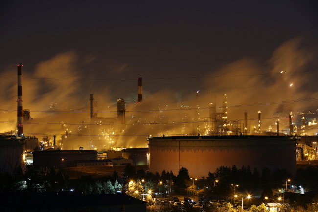 S-Oil’s refinery facilities operate at dawn in Ulsan.   Bloomberg