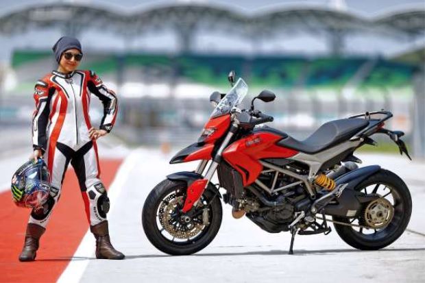 Nurulalis Aidil Akhbar poses with her bike. The Star