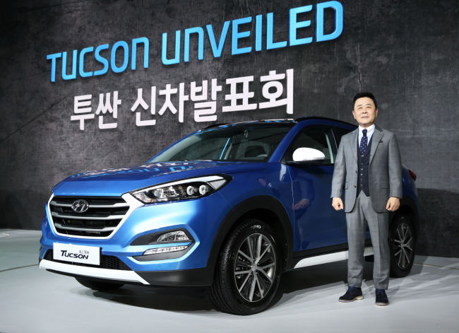 Kwak Jin, executive vice president of the domestic sales division at Hyundai Motor, poses with the all-new Tucson on Tuesday at a Seoul hotel.   Hyundai Motor
