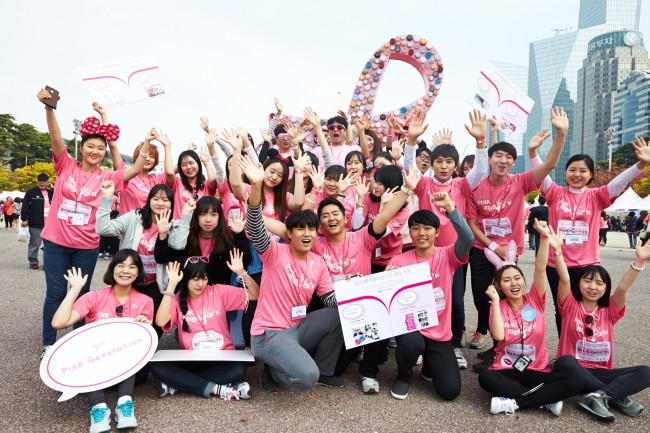 Participants pose after attending the Pink Ribbon Love Marathon event
last year.   AmorePacific