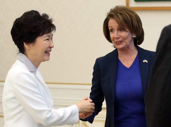 President Park Geun-hye welcomes U.S. House Minority Leader Nancy Pelosi at the presidential office of Cheong Wa Dae Thursday.   Yonhap