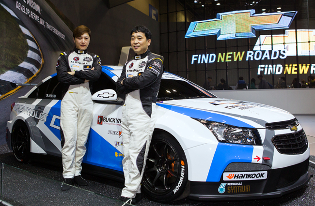 Two veterans of Chevrolet racing team pose next to the upgraded racing car Cruze at the Chevrolet booth for the 2015 Seoul Motor Show, while announcing that they are ready to join the 2015 CJ Hello Mobile Superrace Championship.    GM Korea
Two veterans of Chevrolet racing team pose next to the upgraded racing car Cruze at the Chevrolet booth for the 2015 Seoul Motor Show, while announcing that they are ready to join the 2015 CJ Hello Mobile Superrace Championship.    GM Korea
Two veterans of Chevrolet racing team pose next to the upgraded racing car Cruze at the Chevrolet booth for the 2015 Seoul Motor Show, while announcing that they are ready to join the 2015 CJ Hello Mobile Superrace Championship.    GM Korea