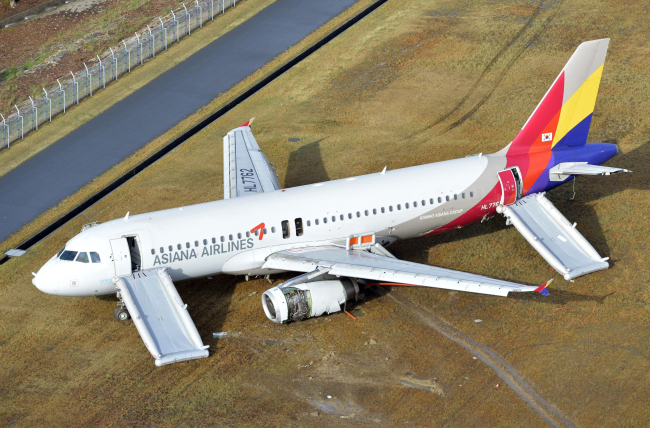 An Asiana Airlines plane sits at Hiroshima airport in western Japan after it skidded off a runway Tuesday.   Yonhap