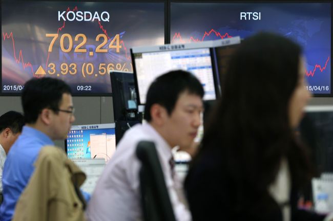 An electronic board at a dealing room in Korea Exchange Bank shows the tech-heavy KOSDAQ index, which exceeded the 700-point mark for the first time since January 2008 on Friday.   Yonhap