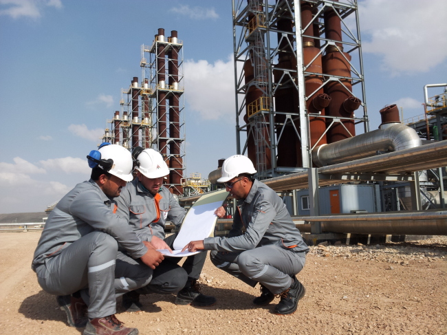 Employees work at the Amman Asia Power Plant operated by KEPCO.   KEPCO