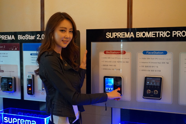 A model poses with Suprema’s new fingerprint reader BioStation2 in Seoul on Thursday.   Suprema