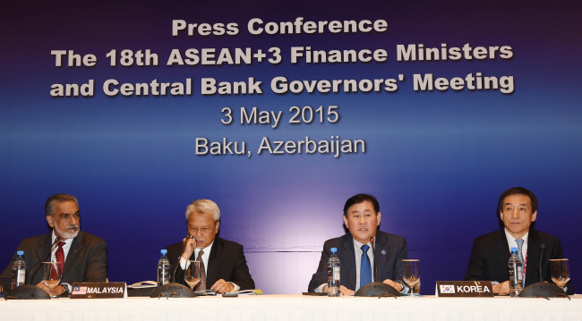 South Korean Finance Minister Choi Kyung-hwan (second from right) and Bank of Korea Gov. Lee Ju-yeol (right) attend a joint press conference after the meeting of financial chiefs of ASEAN Plus Three in Baku, Azerbaijan, on Sunday.   Finance Ministry
South Korean Finance Minister Choi Kyung-hwan (second from right) and Bank of Korea Gov. Lee Ju-yeol (right) attend a joint press conference after the meeting of financial chiefs of ASEAN Plus Three in Baku, Azerbaijan, on Sunday.   Finance Ministry