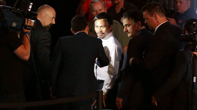 Manny Pacquiao leaves after a press conference following his defeat to Floyd Mayweather.   Philippine Daily Inquirer