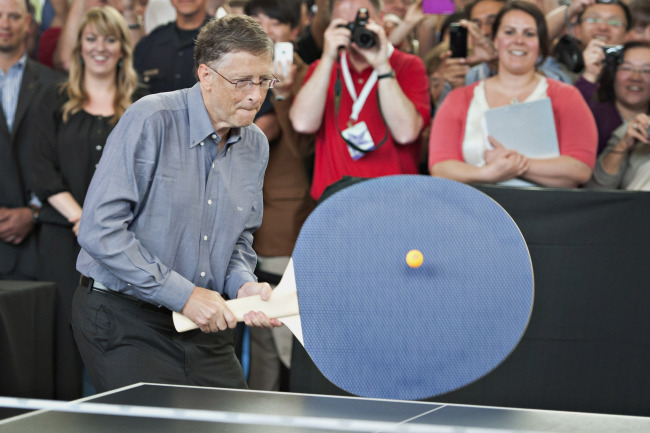 Bill Gates plays with a large table tennis paddle at the annual Berkshire Hathaway Inc. shareholders meeting in 2012.    Bloomberg
Bill Gates plays with a large table tennis paddle at the annual Berkshire Hathaway Inc. shareholders meeting in 2012.    Bloomberg