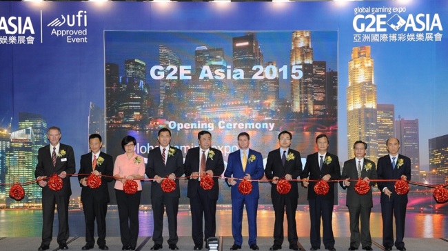 Executive officials cut the tape at the opening ceremony of G2E Asia 2015, an annual conference dedicated to the Asian casino business, held at the Venetian Macau on Tuesday.    G2E Asia