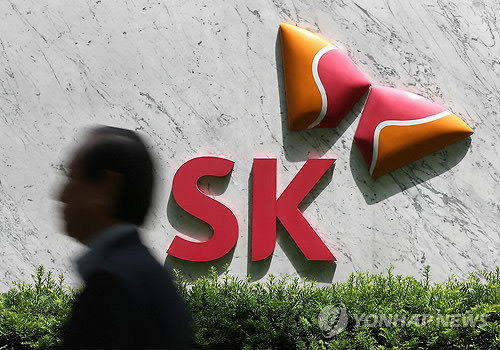 A man walks past the headquarters of SK Group in central Seoul.    Yonhap