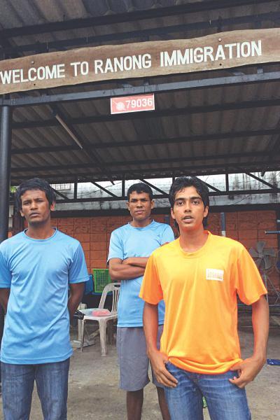 From left: Bangladeshis Shahbuddin, Noor-e-Alam and Nur Alam at the Ranong Immigration Detention Center.    The Daily Star