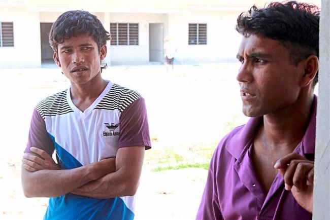 Mohamed Alam (right) and Sonso speak during an interview at their living quarters in Kangar.    The Star
