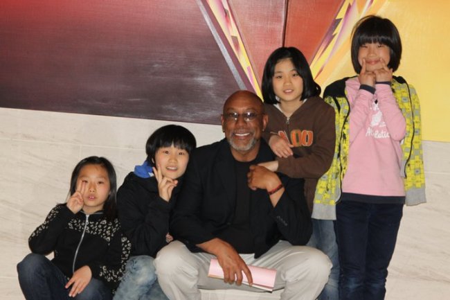 Al Barnum poses with children from the Sungbin Orphanage in Gwangju.   Al Barnum