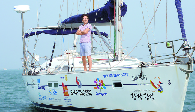 Kim Seung-jin poses aboard the Arapani, anchored off Waemokhang Harbor in Dangjin, South Chungcheong Province, on June 10. (Ahn Hoon/The Korea Herald)