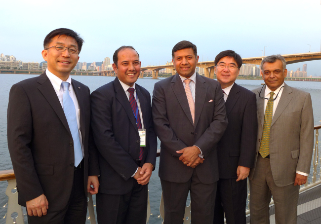 From left: LG CNS vice president Lee Eung-joon; Prem Singh, deputy director of the LBSNAA Indian civil service training center; Indian Ambassador Vikram Doraiswami; Hong Taek-chun, dean of the Korea Development Institute; and Mahindra Korea country director Dilip Sundaram pose at a reception for Indian Administration Service officers on the E-Land Cruise on Wednesday in Seoul.   Joel Lee/The Korea Herald
From left: LG CNS vice president Lee Eung-joon; Prem Singh, deputy director of the LBSNAA Indian civil service training center; Indian Ambassador Vikram Doraiswami; Hong Taek-chun, dean of the Korea Development Institute; and Mahindra Korea country director Dilip Sundaram pose at a reception for Indian Administration Service officers on the E-Land Cruise on Wednesday in Seoul.   Joel Lee/The Korea Herald