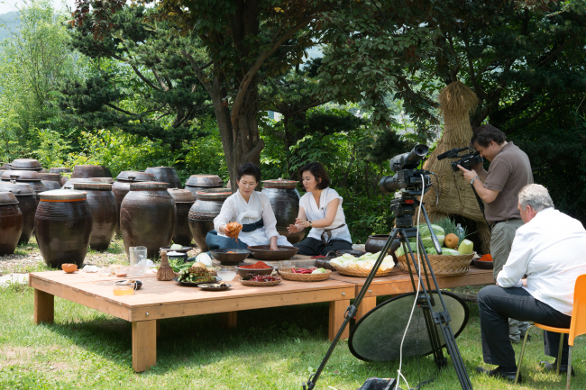 Filming how to make kimchi in Korea last month for the Cultural Institute of Americas’s upcoming “Savoring the Best of World Flavors: Korea” documentary.   John Barkley