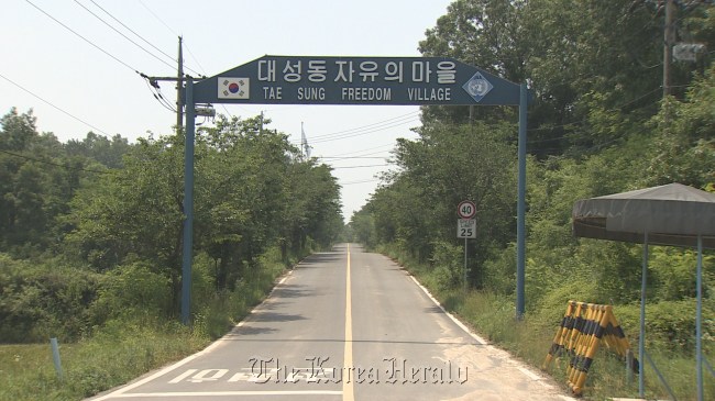 A sign points to the entrance of Daeseong-dong, the only civilian residential area within the Southern part of the Demilitarized Zone. Yonhap