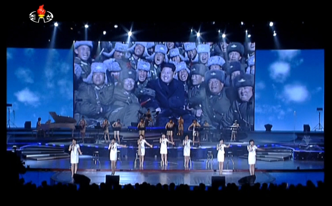 North Korean leader Kim Jong-un appears on the screen during a recent performance by the North’s Moranbong troupe. (Yonhap)